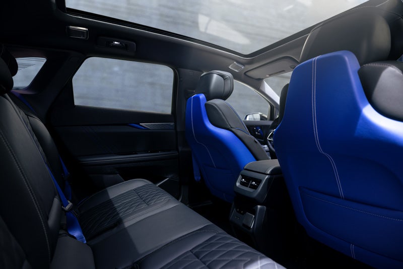 Back Seat View of the 2026 OPTIQ-V Blue Front Seats, Sun Roof, and Interior | McGuire Cadillac in Woodbridge NJ